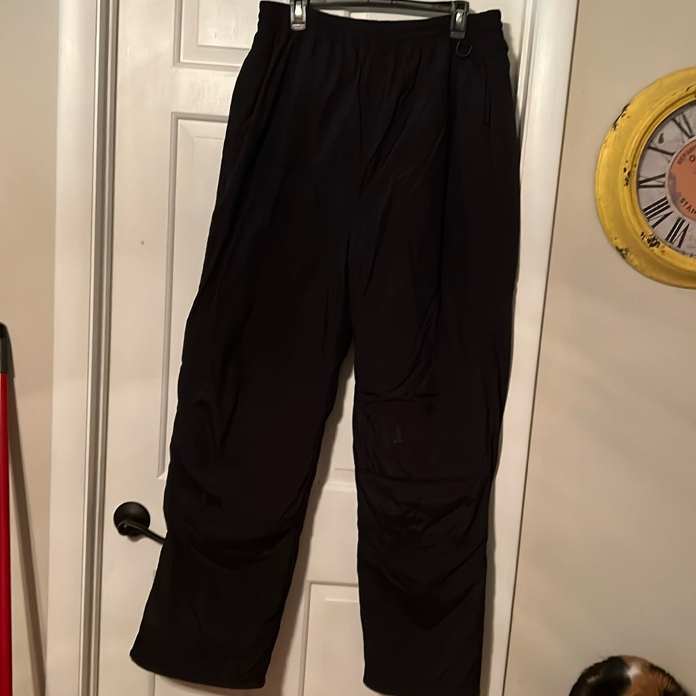 Bundle of men’s snow pants and overalls,